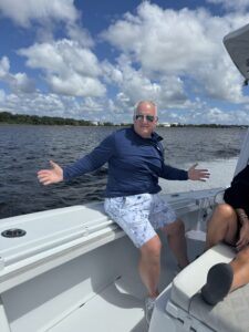 a man smiles on a boat