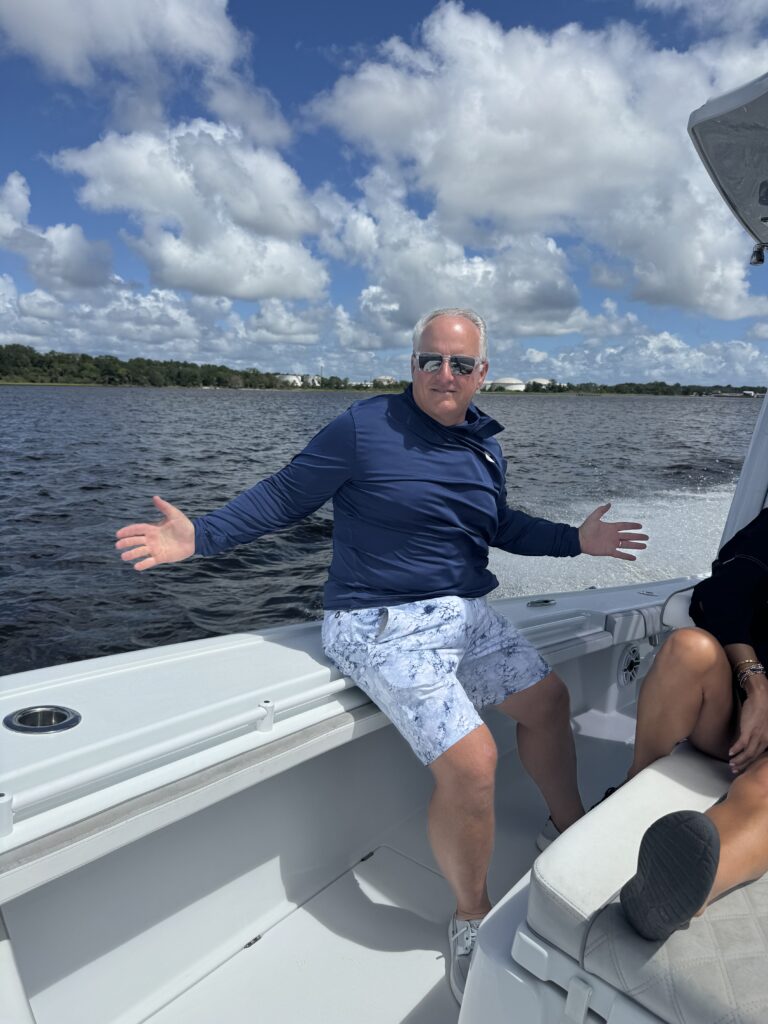 a man smiles on a boat